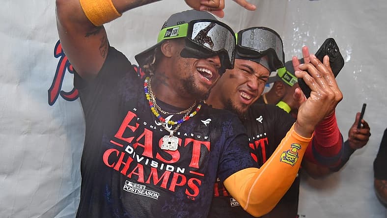 Sep 13, 2023; Philadelphia, Pennsylvania, USA; Atlanta Braves right fielder Ronald Acuna Jr. (13) and shortstop Orlando Arcia (11) celebrate their 6th straight National League East title in the locker room after win against the Philadelphia Phillies at Citizens Bank Park. Mandatory Credit: Eric Hartline-USA TODAY Sports