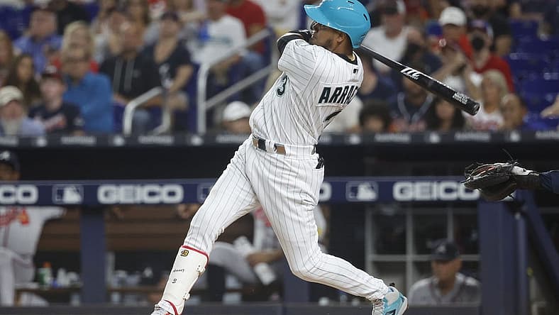 Sep 15, 2023; Miami, Florida, USA; Miami Marlins second baseman Luis Arraez (3) hits a home run against the Atlanta Braves during the first inning at loan Depot Park. Mandatory Credit: Rhona Wise-USA TODAY Sports