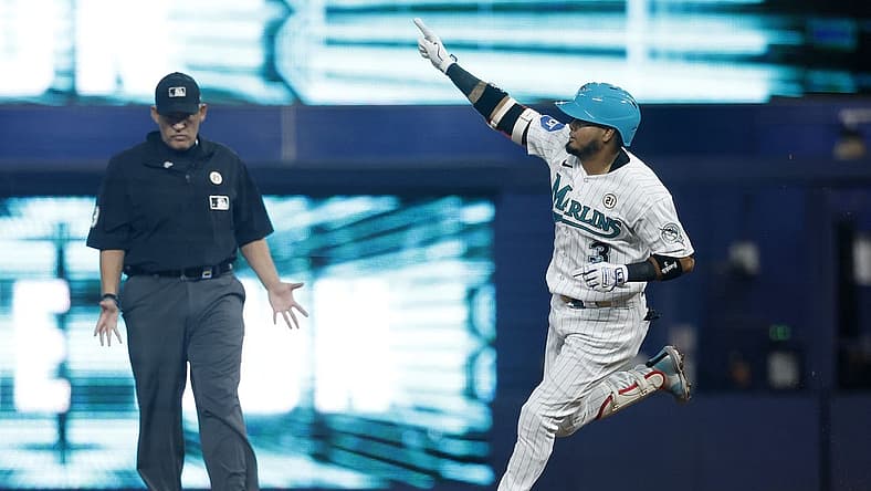 Sep 15, 2023; Miami, Florida, USA; Miami Marlins second baseman Luis Arraez (3) hits a home run against the Atlanta Braves during the first inning at loanDepot Park. Mandatory Credit: Rhona Wise-USA TODAY Sports