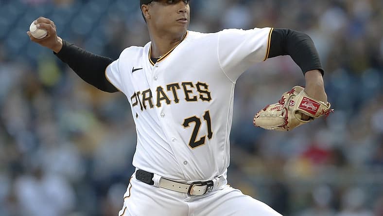 Sep 15, 2023; Pittsburgh, Pennsylvania, USA; Pittsburgh Pirates starting pitcher Johan Oviedo (24 wearing 21) delivers a pitch against the New York Yankees during the first inning at PNC Park. Mandatory Credit: Charles LeClaire-USA TODAY Sports