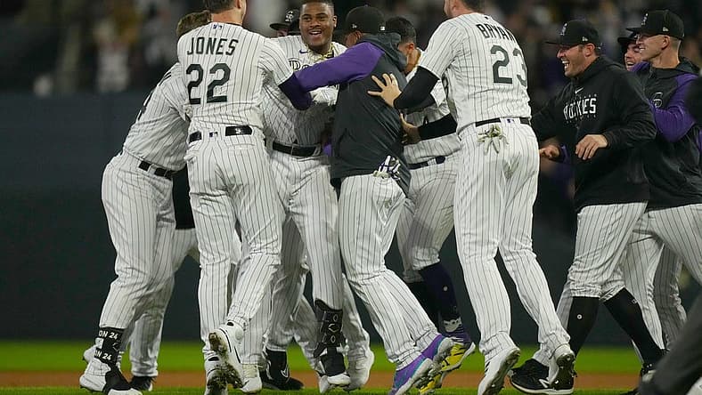 Sep 15, 2023; Denver, Colorado, USA; Colorado Rockies first baseman Elehuris Montero (44) and Colorado Rockies left fielder Nolan Jones (22) and Colorado Rockies designated hitter Kris Bryant (23) celebrate defeating the San Francisco Giants in the ninth inning at Coors Field. Mandatory Credit: Ron Chenoy-USA TODAY Sports