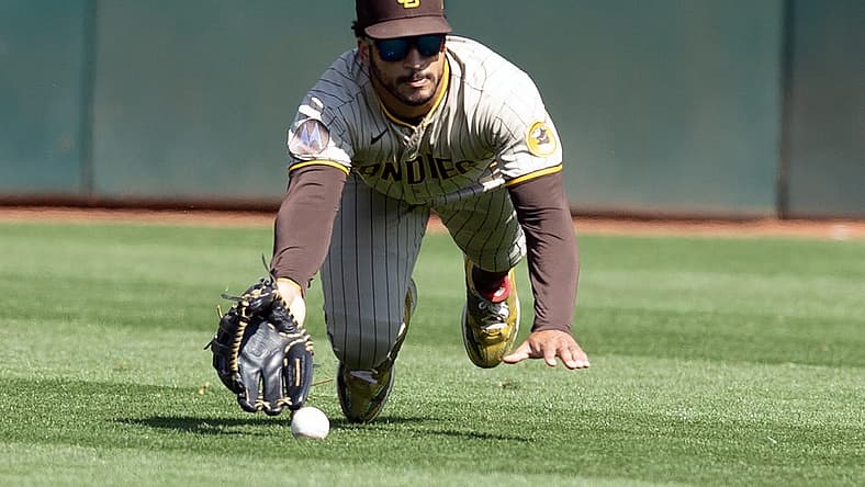 Sep 16, 2023; Oakland, California, USA; San Diego Padres center fielder Trent Grisham (1) misses a catch hit by Oakland Athletics center fielder Lawrence Butler during the fourth inning at Oakland-Alameda County Coliseum. Mandatory Credit: D. Ross Cameron-USA TODAY Sports