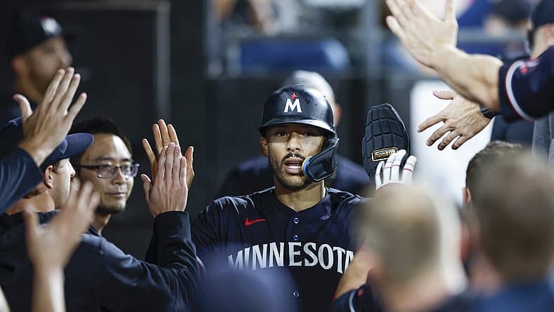 Sep 16, 2023; Chicago, Illinois, USA; Minnesota Twins shortstop Carlos Correa (4) celebrates with teammates after scoring against the Chicago White Sox during the eight inning at Guaranteed Rate Field. Mandatory Credit: Kamil Krzaczynski-USA TODAY Sports