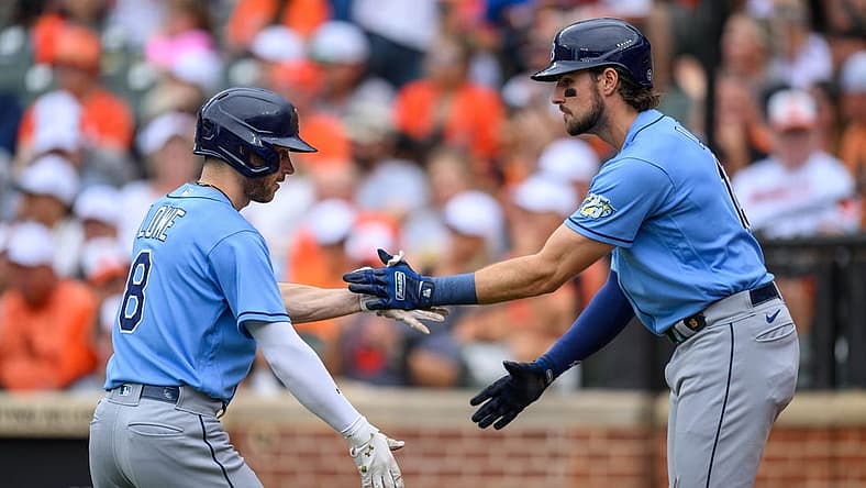 Sep 17, 2023; Baltimore, Maryland, USA; Tampa Bay Rays second baseman Brandon Lowe (8) and right fielder Josh Lowe (15) celebrate after a home run during the first inning against the Baltimore Orioles at Oriole Park at Camden Yards. Mandatory Credit: Reggie Hildred-USA TODAY Sports