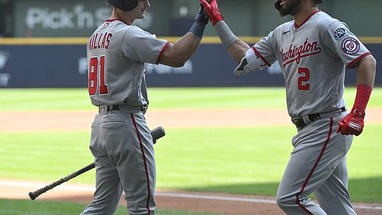 Sep 17, 2023; Milwaukee, Wisconsin, USA;Washington Nationals catcher Drew Millas (81), left congratulates Washington Nationals second baseman Luis Garcia (2) after hitting a home run against the Milwaukee Brewers in the first inning at American Family Field. Mandatory Credit: Michael McLoone-USA TODAY Sports