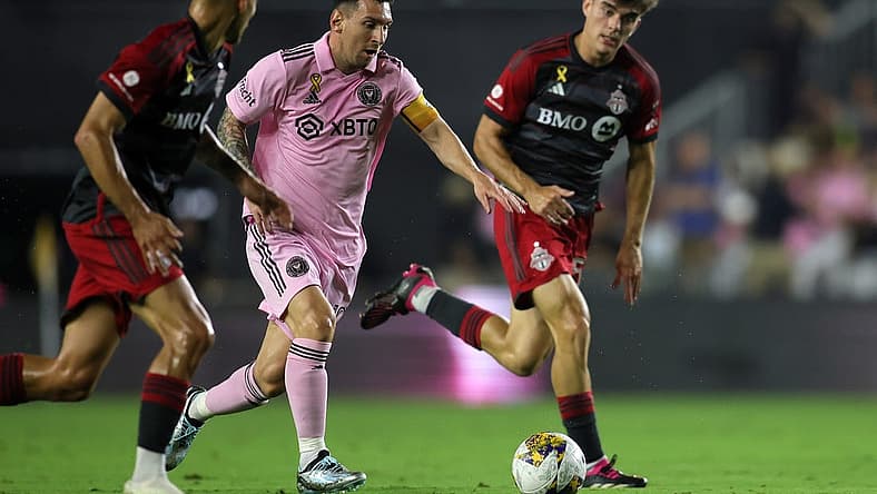 Sep 20, 2023; Fort Lauderdale, Florida, USA; Inter Miami forward Lionel Messi (10) kicks the ball past Toronto FC during the first half at DRV PNK Stadium. Mandatory Credit: Sam Navarro-USA TODAY Sports