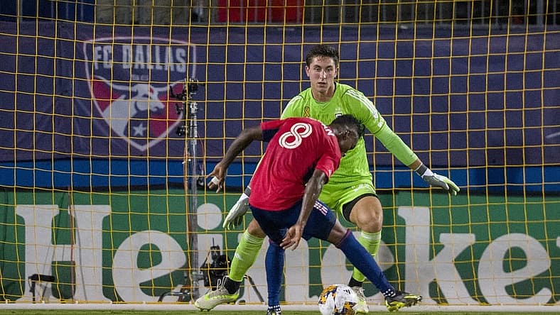 Sep 23, 2023; Frisco, Texas, USA; Columbus Crew goalkeeper Patrick Schulte (28) stops a shot by FC Dallas forward Jader Obrian (8) during the first half at Toyota Stadium. Mandatory Credit: Jerome Miron-USA TODAY Sports