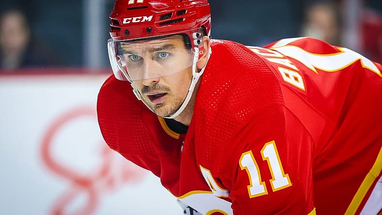 Sep 25, 2023; Calgary, Alberta, CAN; Calgary Flames center Mikael Backlund (11) during the face off against the Seattle Kraken during the second period at Scotiabank Saddledome. Mandatory Credit: Sergei Belski-USA TODAY Sports
