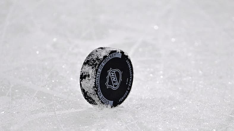 Dec 10, 2022; Montreal, Quebec, CAN; A NHL puck with the French logo during the warmup period before the game between the Los Angeles Kings and the Montreal Canadiens at the Bell Centre. Mandatory Credit: Eric Bolte-USA TODAY Sports