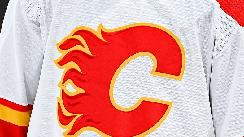 Dec 12, 2022; Montreal, Quebec, CAN; View of a Calgary Flames logo on a jersey worn by the member of the team during the second period at Bell Centre. Mandatory Credit: David Kirouac-USA TODAY Sports