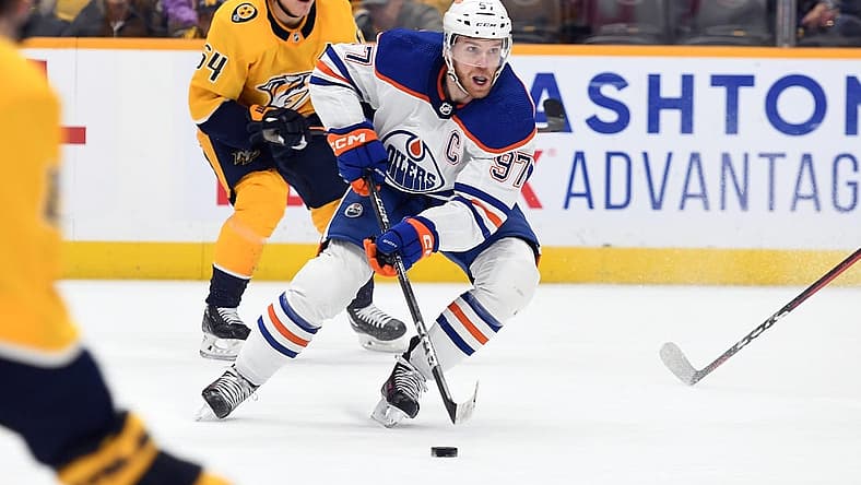 Dec 19, 2022; Nashville, Tennessee, USA; Edmonton Oilers center Connor McDavid (97) skates with the puck during the second period against the Nashville Predators at Bridgestone Arena. Mandatory Credit: Christopher Hanewinckel-USA TODAY Sports