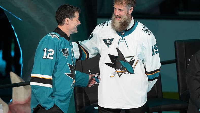 Feb 25, 2023; San Jose, California, USA; San Jose Sharks former player Patrick Marleau talks to former player Joe Thornton during his jersey retirement ceremony before the game against the Chicago Blackhawks at SAP Center at San Jose. Mandatory Credit: Darren Yamashita-USA TODAY Sports