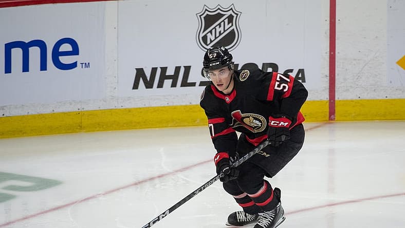 Mar 30, 2023; Ottawa, Ontario, CAN; Ottawa Senators center Shane Pinto (57) skates with the puck in the third period againstthe Philadelphia Flyers at the Canadian Tire Centre. Mandatory Credit: Marc DesRosiers-USA TODAY Sports