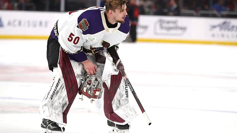 Tucson Roadrunners goalie Ivan Prosvetov (50) removes his helmet during a brief stop in play against the Coachella Valley Firebirds at Acrisure Arena in Palm Desert, Calif., on Friday, April 21, 2023.
Firebirds Vs Roadrunners Game 1 Calder Cup Playoffs6068