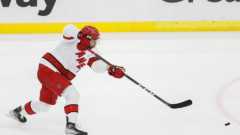 May 24, 2023; Sunrise, Florida, USA; Carolina Hurricanes defenseman Shayne Gostisbehere (41) shoots the puck against the Florida Panthers during the third period in game four of the Eastern Conference Finals of the 2023 Stanley Cup Playoffs at FLA Live Arena. Mandatory Credit: Sam Navarro-USA TODAY Sports