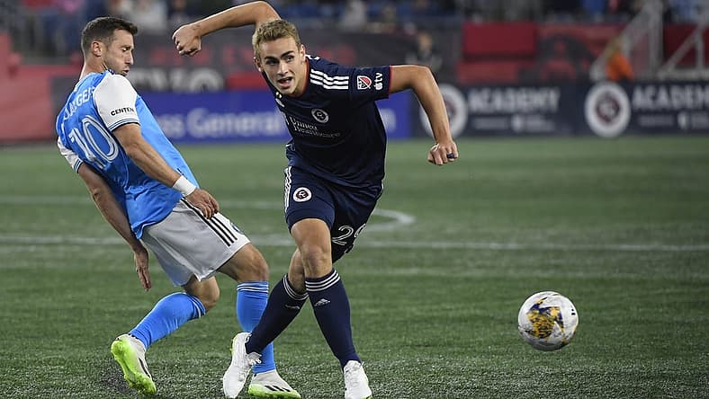 Sep 30, 2023; Foxborough, Massachusetts, USA;  Charlotte FC midfielder Brecht Dejaegere (10) and New England Revolution midfielder Noel Buck (29) battle for the ball during the first half at Gillette Stadium. Mandatory Credit: Bob DeChiara-USA TODAY Sports