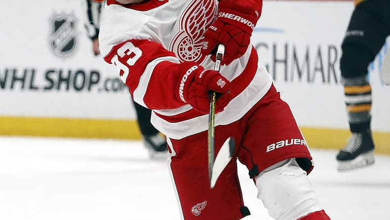 Oct 4, 2023; Pittsburgh, Pennsylvania, USA; Detroit Red Wings Detroit Red Wings right wing Alex DeBrincat (93) takes a slap shot against the Pittsburgh Penguins during the second period at PPG Paints Arena. Mandatory Credit: Charles LeClaire-USA TODAY Sports