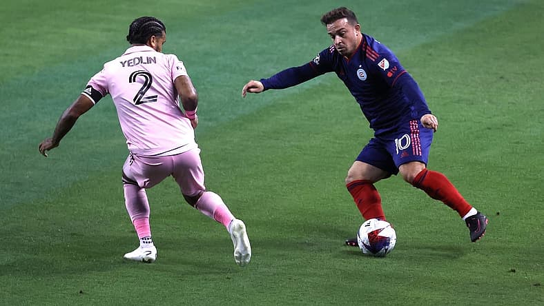 Oct 4, 2023; Chicago, Illinois, USA; Chicago Fire midfielder Xherdan Shaqiri (10) controls the ball during the first half while defended by Inter Miami CF defender DeAndre Yedlin (2) at Soldier Field. Mandatory Credit: Jon Durr-USA TODAY Sports