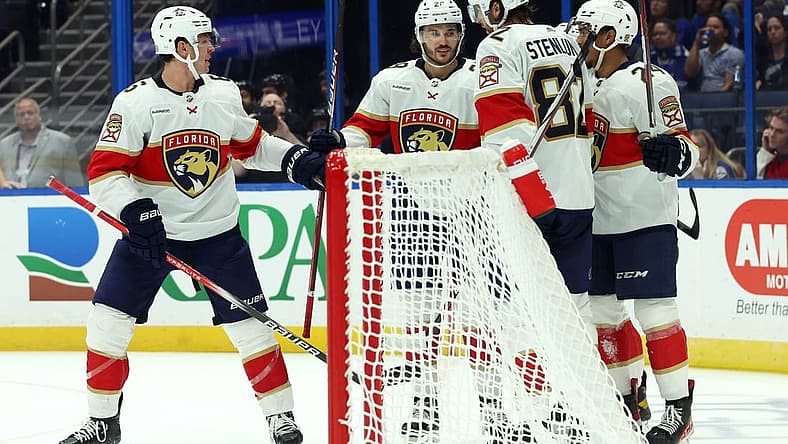 Oct 5, 2023; Tampa, Florida, USA; Florida Panthers left wing Ryan Lomberg (94) is congratulated after he scored a goal against the Tampa Bay Lightning during the third period at Amalie Arena. Mandatory Credit: Kim Klement Neitzel-USA TODAY Sports