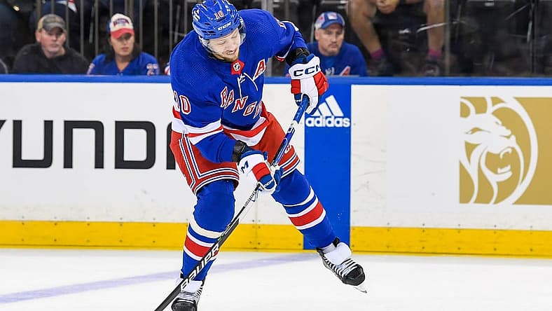 Oct 5, 2023; New York, New York, USA; New York Rangers left wing Artemi Panarin (10) shoots the puck against the Boston Bruins during the third at Madison Square Garden. Mandatory Credit: Dennis Schneidler-USA TODAY Sports