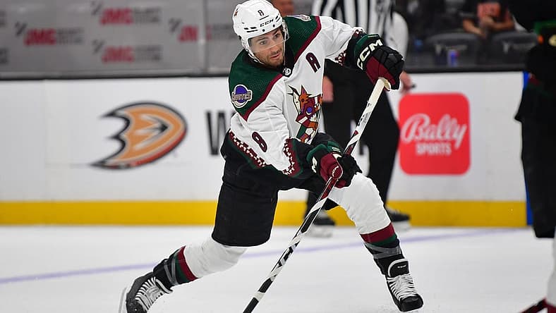 Oct 5, 2023; Anaheim, California, USA; Arizona Coyotes center Nick Schmaltz (8) shoots on goal against the Anaheim Ducks during the first period at Honda Center. Mandatory Credit: Gary A. Vasquez-USA TODAY Sports