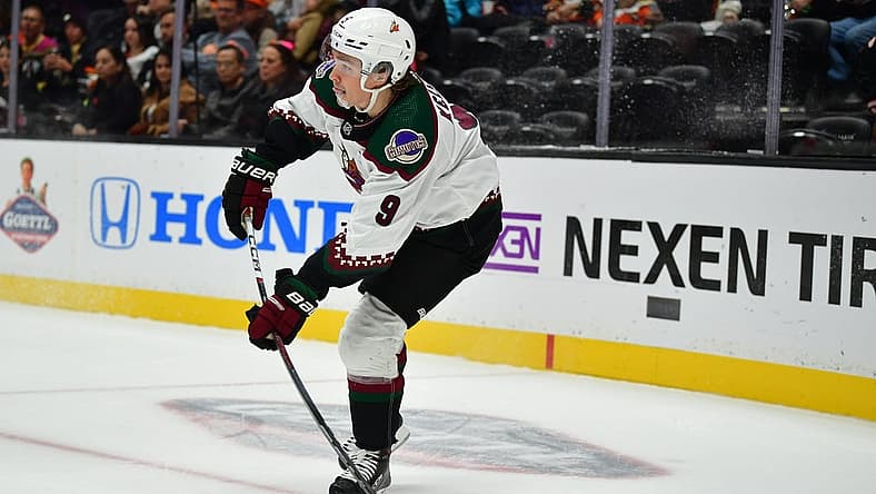 Oct 5, 2023; Anaheim, California, USA; Arizona Coyotes right wing Clayton Keller (9) moves the puck against the Anaheim Ducks during the third period at Honda Center. Mandatory Credit: Gary A. Vasquez-USA TODAY Sports