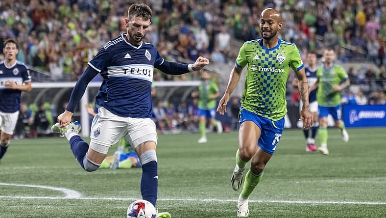 Oct 7, 2023; Seattle, Washington, USA; Vancouver Whitecaps defender Tristan Blackmon (6) passes the ball against Seattle Sounders forward Heber (19) during the second half at Lumen Field. Mandatory Credit: Stephen Brashear-USA TODAY Sports