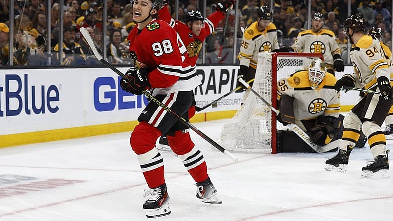 Oct 11, 2023; Boston, Massachusetts, USA; Chicago Blackhawks center Connor Bedard (98) celebrates after scoring his first NHL goal on Boston Bruins goaltender Linus Ullmark (35) during the first period at TD Garden. Mandatory Credit: Winslow Townson-USA TODAY Sports