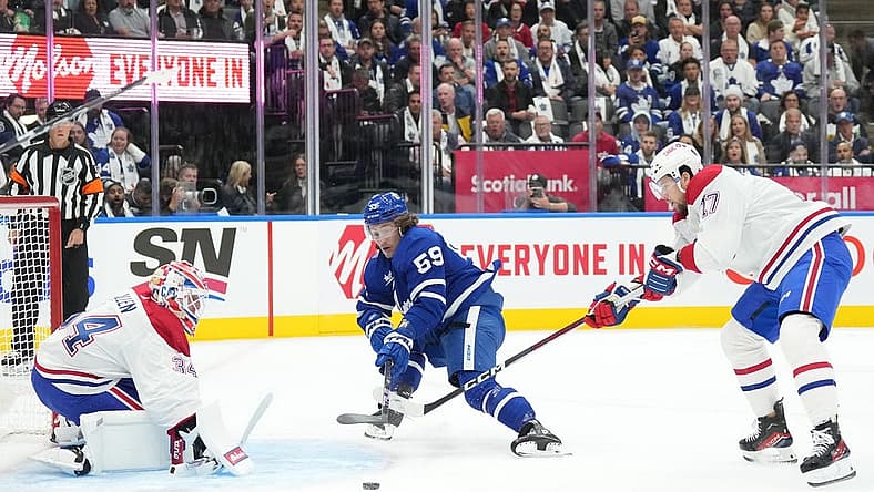 Oct 11, 2023; Toronto, Ontario, CAN; Toronto Maple Leafs left wing Tyler Bertuzzi (59) battles for the puck with Montreal Canadiens right wing Josh Anderson (17) in front of Montreal Canadiens goaltender Jake Allen (34) during the first period at Scotiabank Arena. Mandatory Credit: Nick Turchiaro-USA TODAY Sports