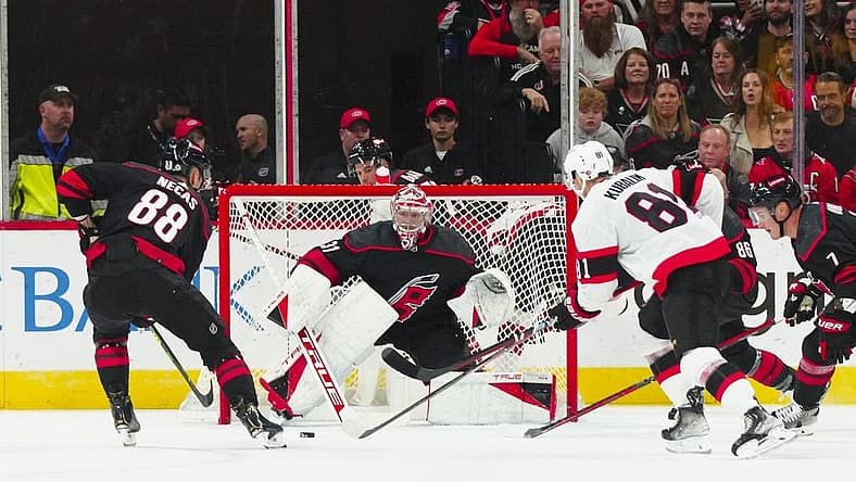 Oct 11, 2023; Raleigh, North Carolina, USA; Carolina Hurricanes goaltender Frederik Andersen (31) center Martin Necas (88) and Ottawa Senators left wing Dominik Kubalik (81) watch the puck during the first period at PNC Arena. Mandatory Credit: James Guillory-USA TODAY Sports