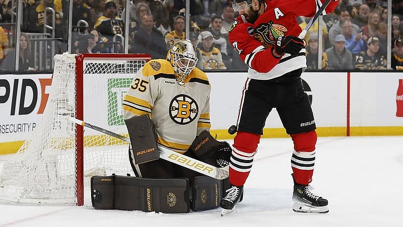 Oct 11, 2023; Boston, Massachusetts, USA; Boston Bruins goaltender Linus Ullmark (35) makes a save as Chicago Blackhawks left wing Nick Foligno (17) looks for the rebound during the first period at TD Garden. Mandatory Credit: Winslow Townson-USA TODAY Sports