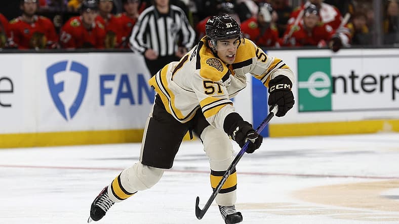 Oct 11, 2023; Boston, Massachusetts, USA; Boston Bruins center Matthew Poitras (51) makes a pass against the Chicago Blackhawks during the second period at TD Garden. Mandatory Credit: Winslow Townson-USA TODAY Sports