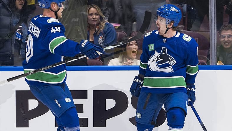Oct 11, 2023; Vancouver, British Columbia, CAN; Vancouver Canucks forward Elias Pettersson (40) and forward Conor Garland (8) celebrate Garland s goal against the Edmonton Oilers in the first period at Rogers Arena. Mandatory Credit: Bob Frid-USA TODAY Sports