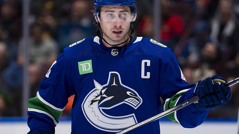 Oct 11, 2023; Vancouver, British Columbia, CAN; Vancouver Canucks defenseman Quinn Hughes (43) during a stop in play against the Edmonton Oilers in the second period at Rogers Arena. Mandatory Credit: Bob Frid-USA TODAY Sports