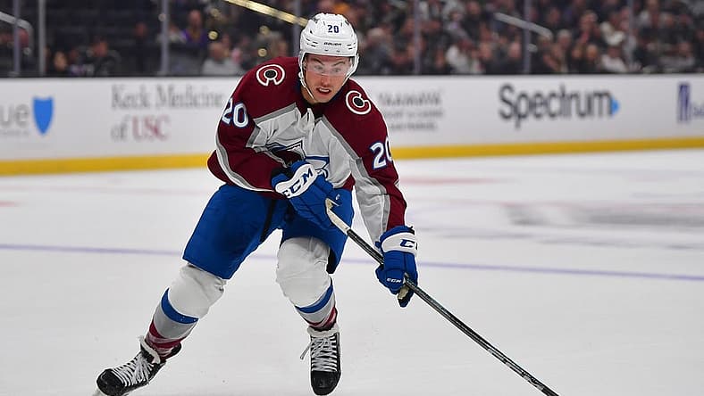 Oct 11, 2023; Los Angeles, California, USA; Colorado Avalanche center Ross Colton (20) moves the puck against the Los Angeles Kings during the first period at Crypto.com Arena. Mandatory Credit: Gary A. Vasquez-USA TODAY Sports
