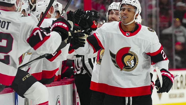 Oct 11, 2023; Raleigh, North Carolina, USA; Ottawa Senators right wing Mathieu Joseph (21) celebrates his goal against the Carolina Hurricanes during the first period at PNC Arena. Mandatory Credit: James Guillory-USA TODAY Sports