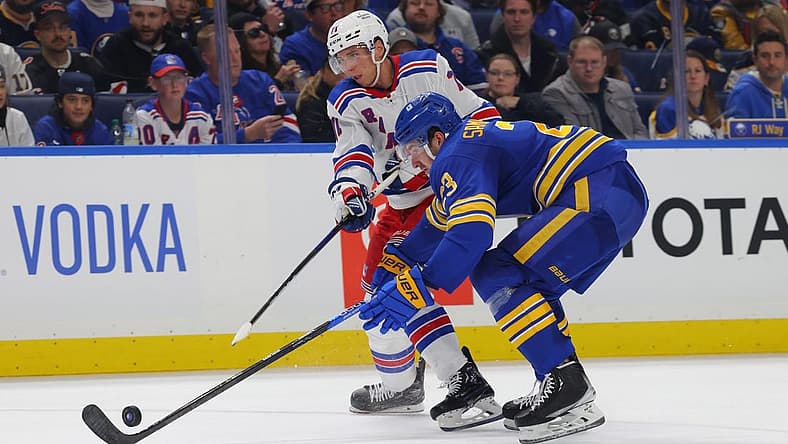 Oct 12, 2023; Buffalo, New York, USA; Buffalo Sabres defenseman Mattias Samuelsson (23) blocks a shot by New York Rangers center Tyler Pitlick (71) during the second period at KeyBank Center. Mandatory Credit: Timothy T. Ludwig-USA TODAY Sports