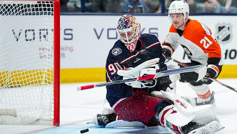 Oct 12, 2023; Columbus, Ohio, USA; Columbus Blue Jackets goaltender Elvis Merzlikins (90) makes a save in net against the Philadelphia Flyers in the second period at Nationwide Arena. Mandatory Credit: Aaron Doster-USA TODAY Sports