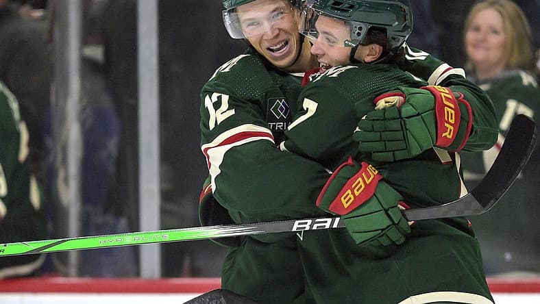 Oct 12, 2023; Saint Paul, Minnesota, USA; Minnesota Wild defense Brock Faber (7) celebrates his goal against the Florida Panthers with forward Matt Boldy (12) during the first period at Xcel Energy Center. Mandatory Credit: Nick Wosika-USA TODAY Sports