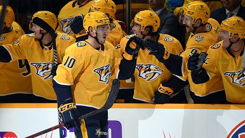 Oct 12, 2023; Nashville, Tennessee, USA; Nashville Predators center Colton Sissons (10) is congratulated by teammates after a goal during the second period against the Seattle Kraken at Bridgestone Arena. Mandatory Credit: Christopher Hanewinckel-USA TODAY Sports