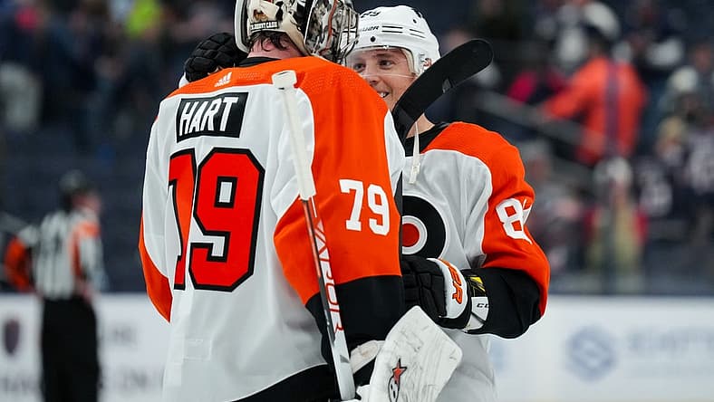 Oct 12, 2023; Columbus, Ohio, USA; Philadelphia Flyers goaltender Carter Hart (79) and right wing Cam Atkinson (89) celebrate on the ice after defeating the Columbus Blue Jackets at Nationwide Arena. Mandatory Credit: Aaron Doster-USA TODAY Sports