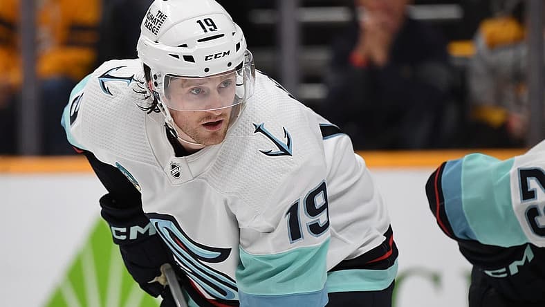 Oct 12, 2023; Nashville, Tennessee, USA; Seattle Kraken left wing Jared McCann (19) waits for a face off during the first period against the Nashville Predators at Bridgestone Arena. Mandatory Credit: Christopher Hanewinckel-USA TODAY Sports