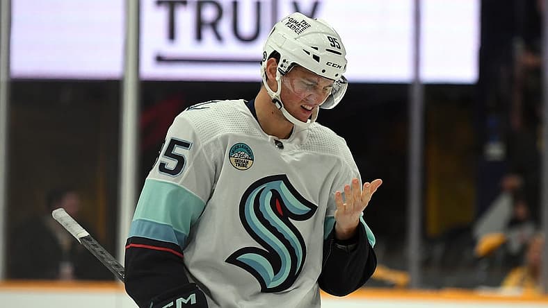 Oct 12, 2023; Nashville, Tennessee, USA; Seattle Kraken left wing Andre Burakovsky (95) checks his face for blood after being hit with a high stick during the third period against the Nashville Predators at Bridgestone Arena. Mandatory Credit: Christopher Hanewinckel-USA TODAY Sports