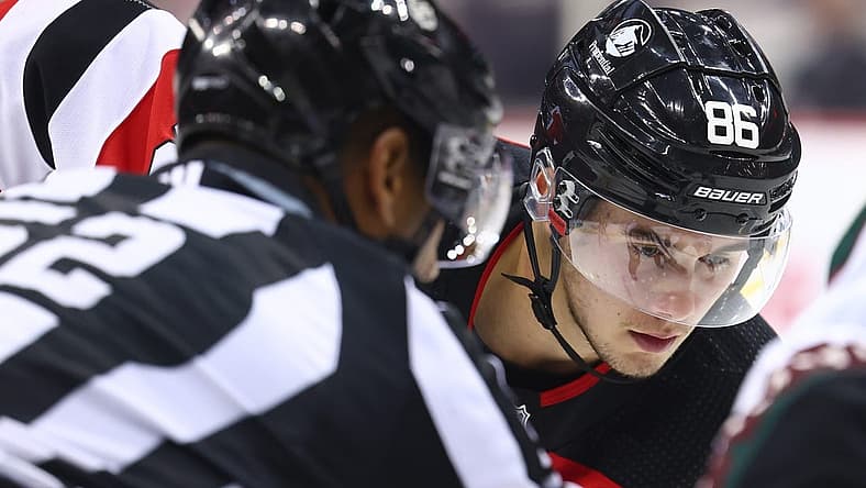 Oct 13, 2023; Newark, New Jersey, USA; New Jersey Devils center Jack Hughes (86) gets ready to face-off against the Arizona Coyotes during the second period at Prudential Center. Mandatory Credit: Ed Mulholland-USA TODAY Sports