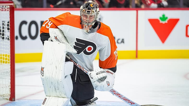 Oct 14, 2023; Ottawa, Ontario, CAN; Philadelphia Flyers goalie Carter Hart (79) stretches during a break in the first period against the Ottawa Senators at the Canadian Tire Centre. Mandatory Credit: Marc DesRosiers-USA TODAY Sports