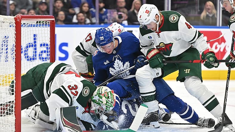 Oct 14, 2023; Toronto, Ontario, CAN; Minnesota Wild goalie Filip Gustavsson (32) makes a save against Toronto Maple Leafs forward Fraser Minten (39) in the first period at Scotiabank Arena. Mandatory Credit: Dan Hamilton-USA TODAY Sports