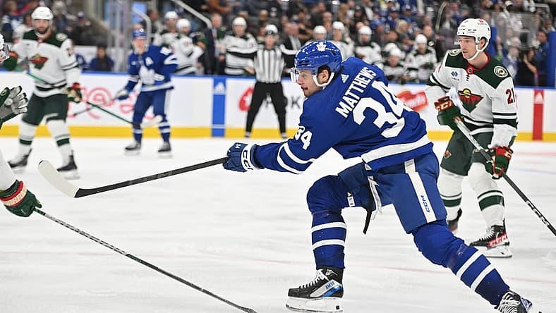 Oct 14, 2023; Toronto, Ontario, CAN; Toronto Maple Leafs forward Auston Matthews (34) shoots the puck against the Minnesota Wild in the third period at Scotiabank Arena. Mandatory Credit: Dan Hamilton-USA TODAY Sports