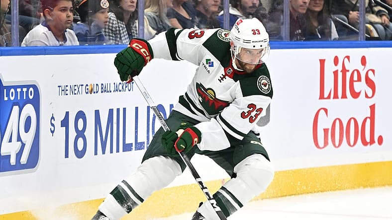 Oct 14, 2023; Toronto, Ontario, CAN; Minnesota Wild defenseman Alex Goligoski (33) turns with the puck against the Toronto Maple Leafs in the first period at Scotiabank Arena. Mandatory Credit: Dan Hamilton-USA TODAY Sports