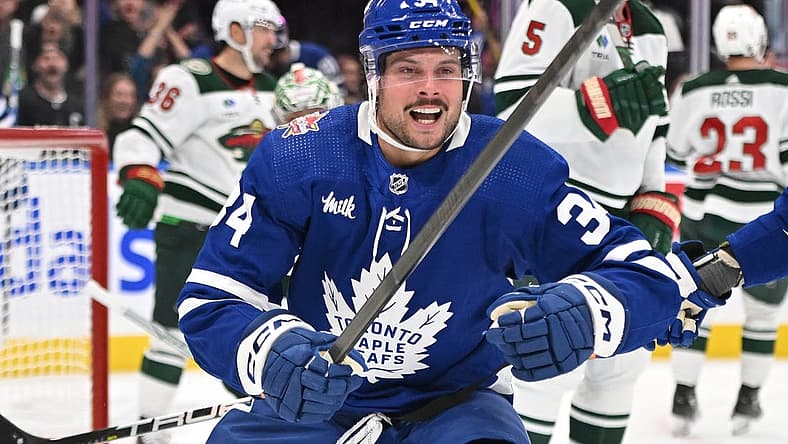 Oct 14, 2023; Toronto, Ontario, CAN; Toronto Maple Leafs forward Auston Matthews (34) celebrates after scoring his third goal of the game against the Minnesota Wild in the third period at Scotiabank Arena. Mandatory Credit: Dan Hamilton-USA TODAY Sports