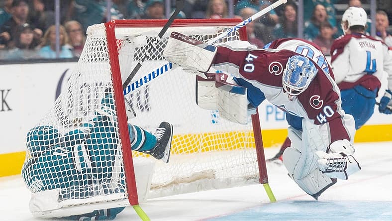 Oct 14, 2023; San Jose, California, USA; Colorado Avalanche goaltender Alexandar Georgiev (40) dodges San Jose Sharks center Luke Kunin (11) during the second period at SAP Center at San Jose. Mandatory Credit: Stan Szeto-USA TODAY Sports